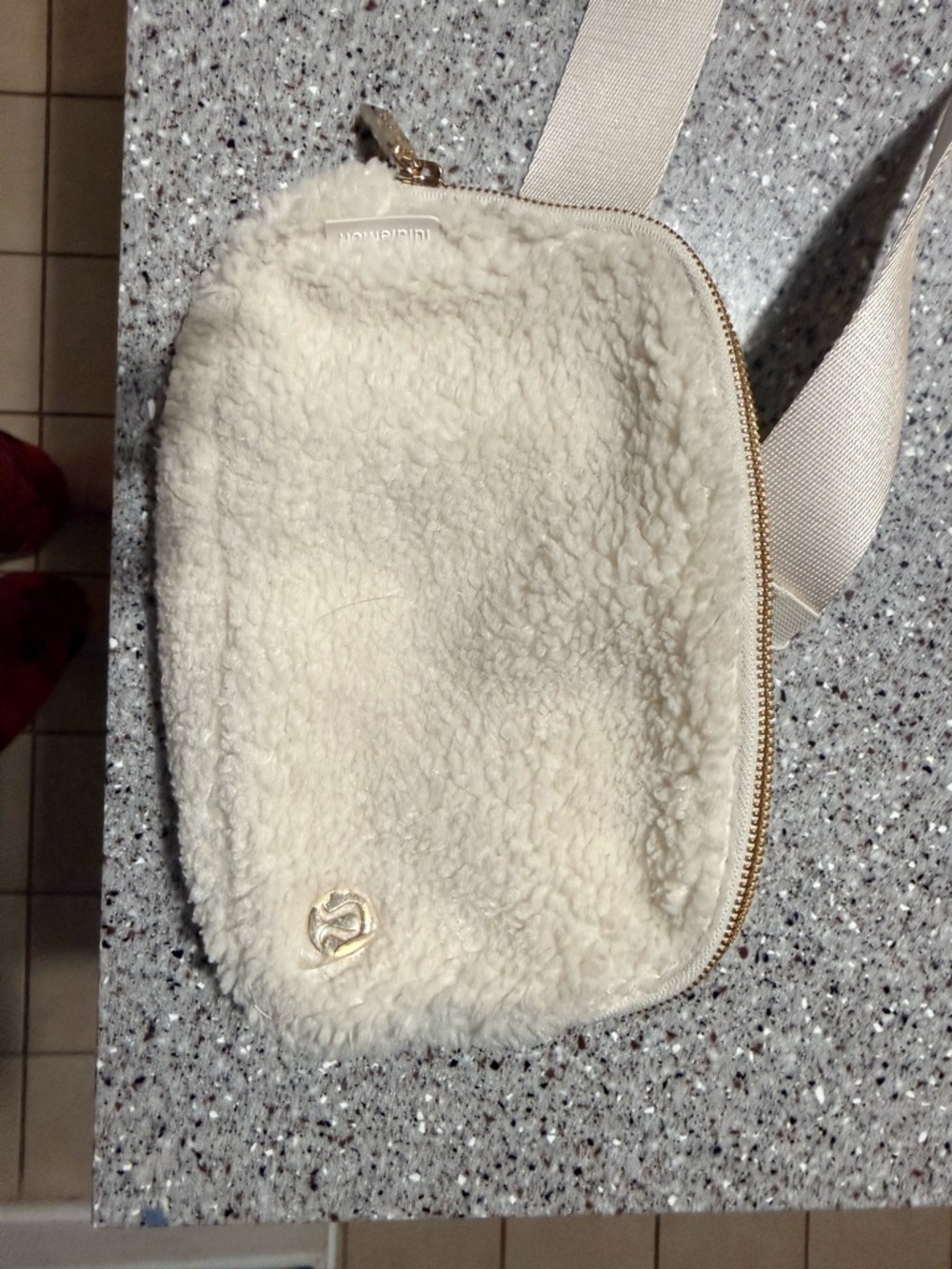 lululemon athletica Cream Sherpa Belt Bag with Gold Hardware.